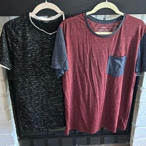 2 men’s Tshirts. One burgundy and blue and one black with white. Size M.